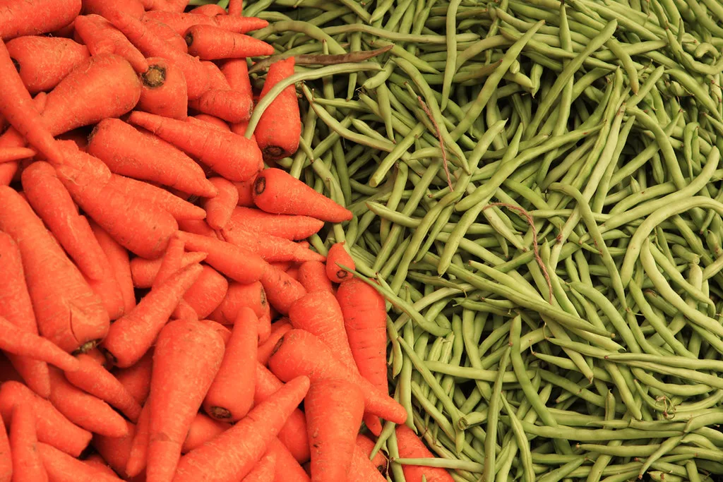 Fresh carrots and beans heaped at the mandi